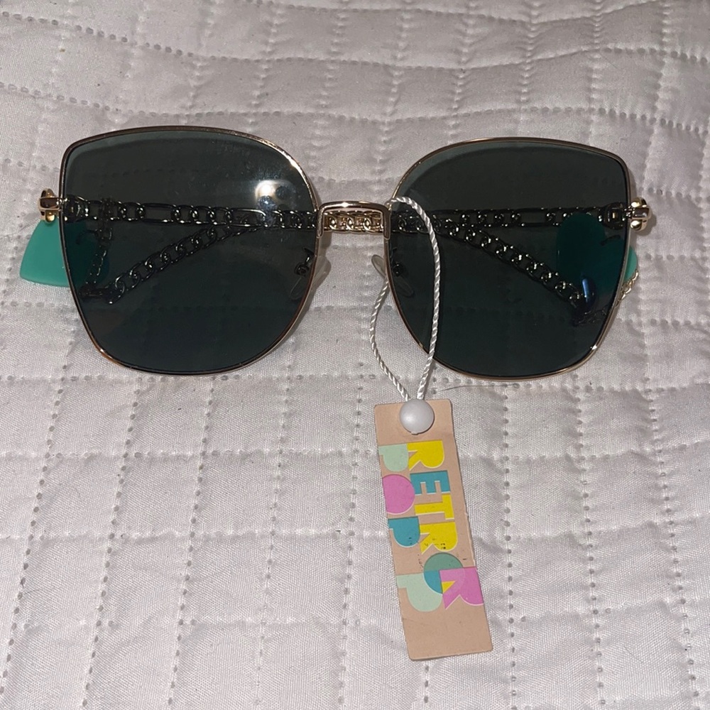 Fashionable sunglasses with blue hearts